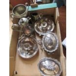 A collection of silver plated items, to include two small covered tureens, a pair of chambersticks