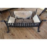 A wrought iron fire grate width 35ins, height 15ins