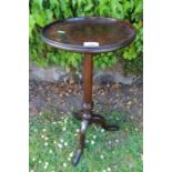 A mahogany dish top tripod table diameter 12ins, height 29ins