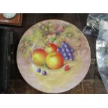 A Royal Worcester plate, decorated with fruit to a mossy background by Aryton, diameter 10.5ins -
