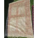 An Eastern style rug, the field divided into four sections, 49ins x 72ins