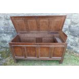 An Antique oak coffer having 4 fielded panels to the front  54ins , depth 23ins height 30ins