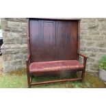 An Antique oak high back settee width 52ins , height 61ins, depth 22ins