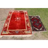 An Eastern design prayer mat 47ins x 28ins together with a Chinese style wall wash rug 55ins x 77ins