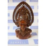 A carved wooden eastern head