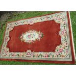 A wool wash rug, decorate with flowers, 48ins x 75ins