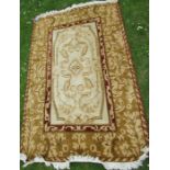 A modern rug, in gold and burgundy, 72ins x 48ins
