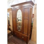 An Edwardian mirror door wardrobe