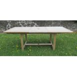 An extending teak garden table with Heals stamp, width 35.5ins height 29.25ins length 110ins when