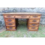 A 19th century mahogany turn pedestal desk having applied molding decoration with some pieces