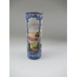 A Royal Worcester cylindrical vase, decorated with an all round pillared arch balustrade with an all