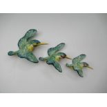 A graduated set of three Beswick flying Kingfishers - The smallest bird is crazed and the middle one