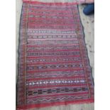 An Eastern design rug, the field decorated with repeating stripes, 45ins x 72ins