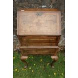 A Queen Anne design walnut bureau raised on cabriole legs width 24ins, height 38.5ins, depth 18ins