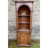 A walnut free standing corner cupboard in two sections with inlaid star decoration height 74ins