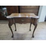 A Georgian design fold over mahogany table fitted with a frieze drawer raised on cabriole legs width