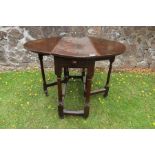 An antique oak gate leg table width 35ins, length 40.5ins, height 28ins