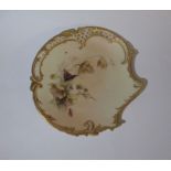 A Royal Worcester shaped pierced plate, decorated with flowers and insects, monogrammed Edward Raby,