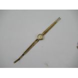 A 9ct Omega ladies watch, with woven bracelet and ladder clasp, stamped 1375, weight 20g