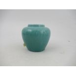 A Ruskin pottery high fired turquoise blue vase, decorated with vine, height 3.5ins - possibly