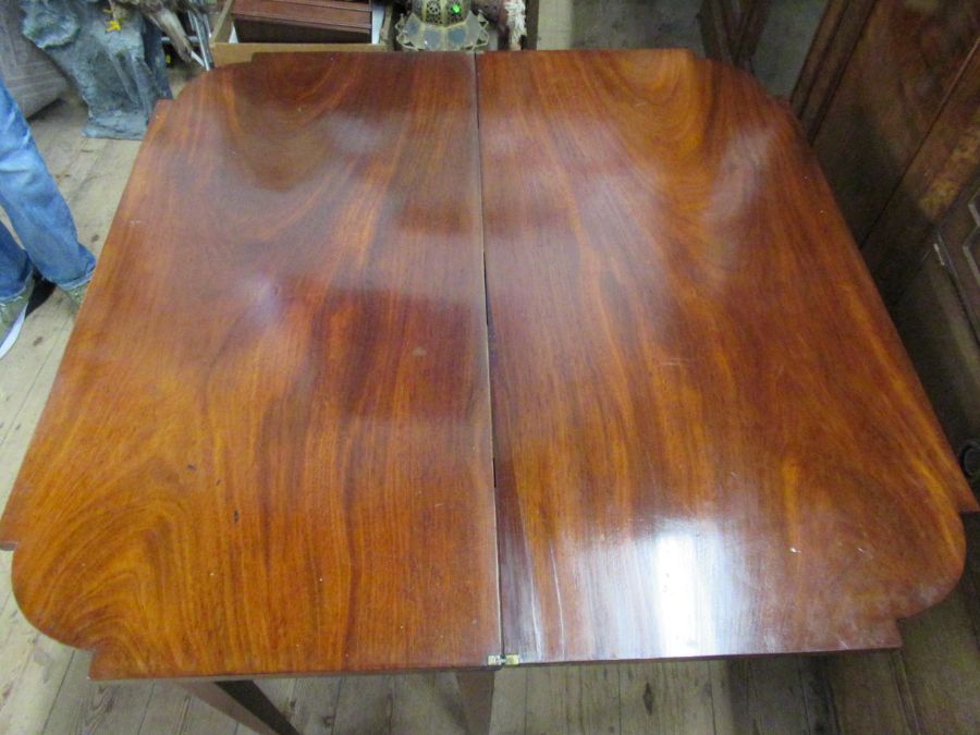 A 19th century mahogany break front fold over tea table, fitted with a drawer , raised on six - Image 4 of 4