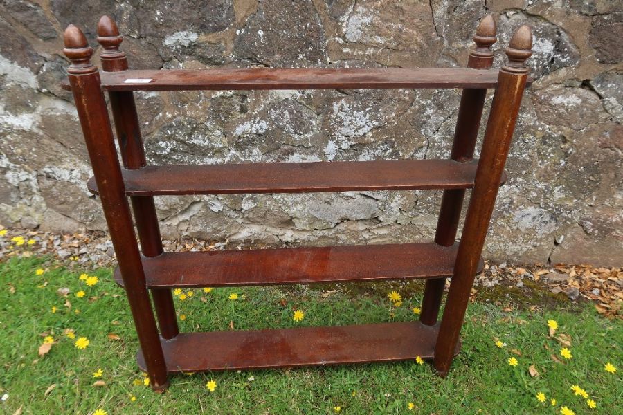 A set of 19th century mahogany shelves with acorn finials width 30ins height 30ins