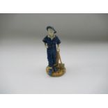 A Royal Worcester figure, decorated in the Sabrina colours, The Gardener, Shape No 1810, height 6.