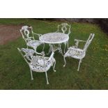 A painted metal garden table and chairs, table diameter 29ins
