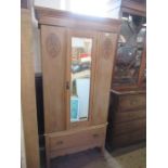A pine mirror door wardrobe