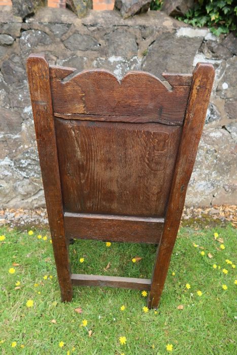 An antique oak Wainscote chair with the back panel having carved decoration. - Image 2 of 3