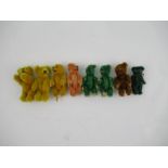 A group of miniature plush teddies, with jointed limbs, in various colours, to include green