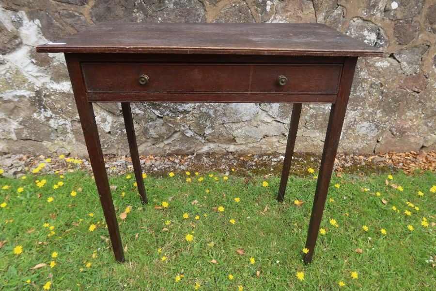 An antique oak side table fitted with long drawer width 30ins, depth 17ins, height 30ins