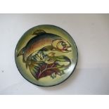 A small Moorcroft dish, decorated with fish, monogrammed AB to the base, diameter 6ins