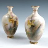 A pair of Hadley’s Worcester vases, decorated all around with daffodils and insects, both very