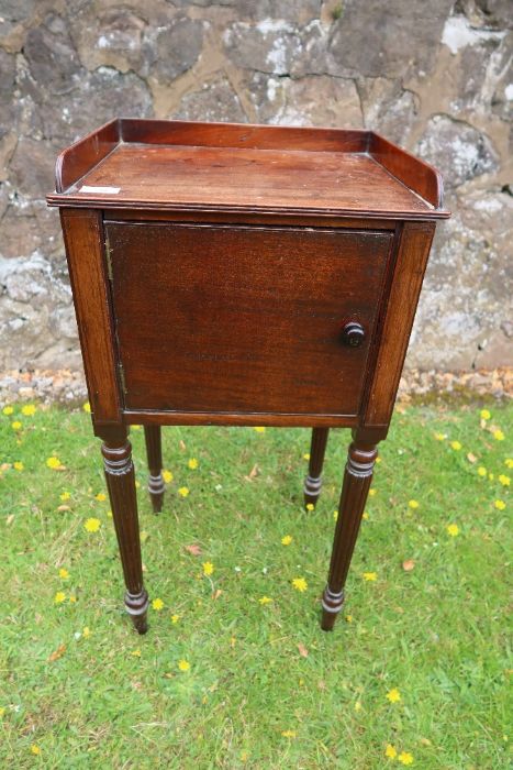 A 19th century Gillows style mahogany pot cupboard raised on reeded legs width 16ins depth 13.