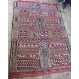 An Eastern design rug, the field decorated with repeating stripes and patterns, 80ins x 55ins