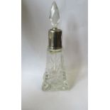 A glass and silver mounted dressing table bottle