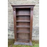 A 19th century  set of shelves having carved column style decoration with adjustable shelves width