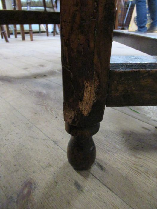 An 18th century yew wood gate leg table, raised on turn baluster legs, 45ins x 39ins, height 29ins - Image 4 of 5
