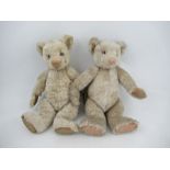 Two gold plush teddy bears, both with jointed limbs, pink rim eyes and pink stitched nose, height