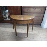 A 19th century mahogany circular shaped fold over card table, 37ins x 18ins, closed 29ins