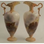 A pair of Royal Worcester ewers, decorated with Highland cattle by John Stinton, shape number