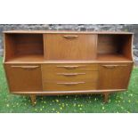 A Retro sideboard, with front flap drinks cabinet, flanked by cupboards with sliding glass doors,