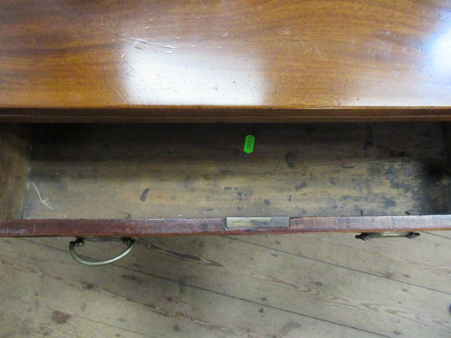 A 19th century mahogany break front fold over tea table, fitted with a drawer , raised on six - Image 3 of 4