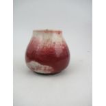 A Ruskin pottery high fired mottled rouge vase, dated 1933, height 3.75ins - Good condition