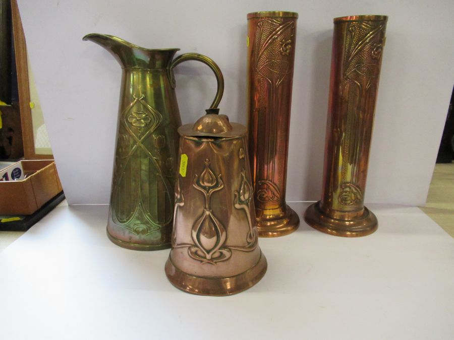 A cooper Arts and Crafts lidded jug, together with a brass Arts and Crafts jug and two