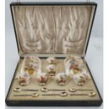 A Royal Worcester cased coffee set, comprising six cups and saucers, decorated with Stags in a