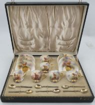 A Royal Worcester cased coffee set, comprising six cups and saucers, decorated with Stags in a