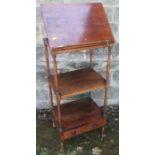 A 19th century rosewood what not having three tiers, the upper section with a ratcheted slope and
