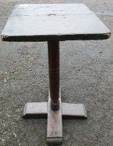 A 17th century primitive yew wood and oak candle stand, the square oak top supported by a turned yew